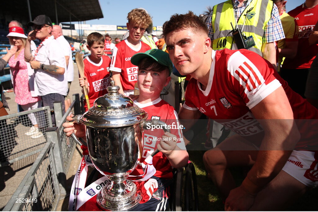 4 June 2023; Michael Mullins of Cork celebrates with a supporter after the O’Neills.com GAA Hurling All-Ireland U20 Championship Final match between Cork and Offaly at FBD Semple Stadium in Thurles, Tipperary. Photo by Michael P Ryan/Sportsfile