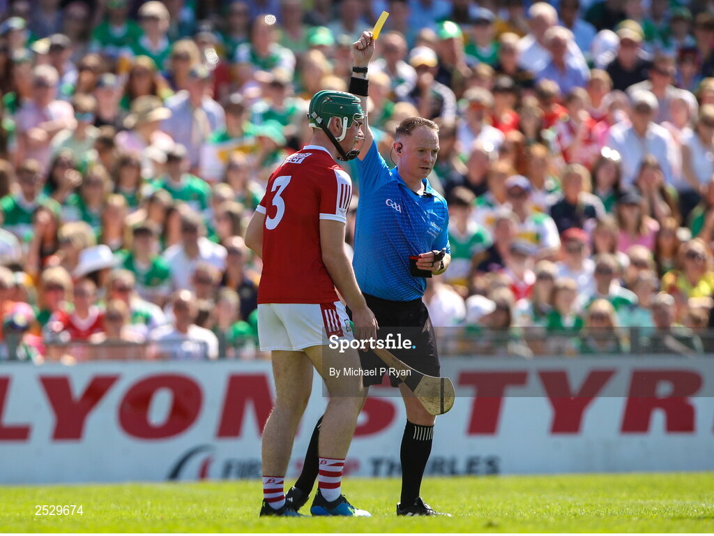 4 June 2023; Shane Kingston of Cork is shown a yellow card by referee Chris Mooney during the O’Neills.com GAA Hurling All-Ireland U20 Championship Final match between Cork and Offaly at FBD Semple Stadium in Thurles, Tipperary. Photo by Michael P Ryan/Sportsfile