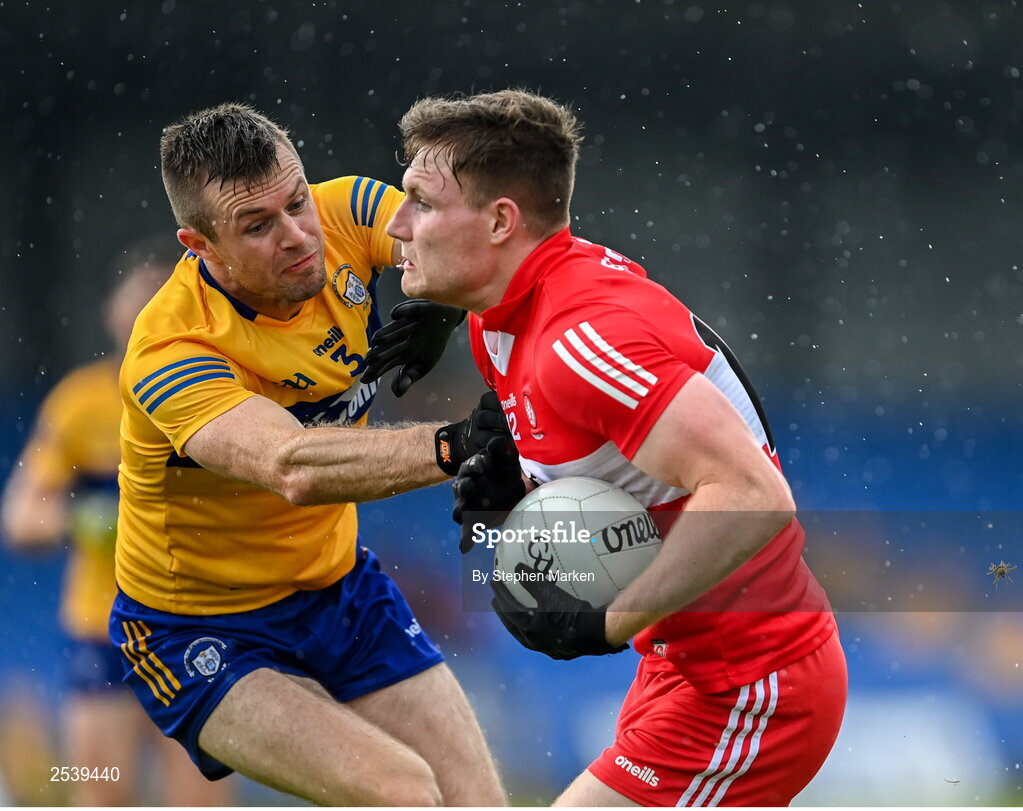 17 June 2023; Ethan Doherty of Derry in action against Ciaran Russell of Clare during the GAA Football All-Ireland Senior Championship Round 3 match between Derry and Clare at Glennon Brothers Pearse Park in Longford. Photo by Stephen Marken/Sportsfile