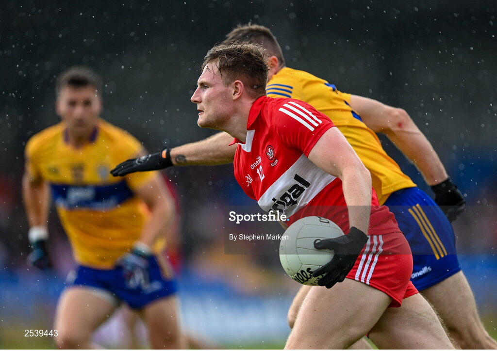 17 June 2023; Ethan Doherty of Derry in action against Ciaran Russell of Clare during the GAA Football All-Ireland Senior Championship Round 3 match between Derry and Clare at Glennon Brothers Pearse Park in Longford. Photo by Stephen Marken/Sportsfile