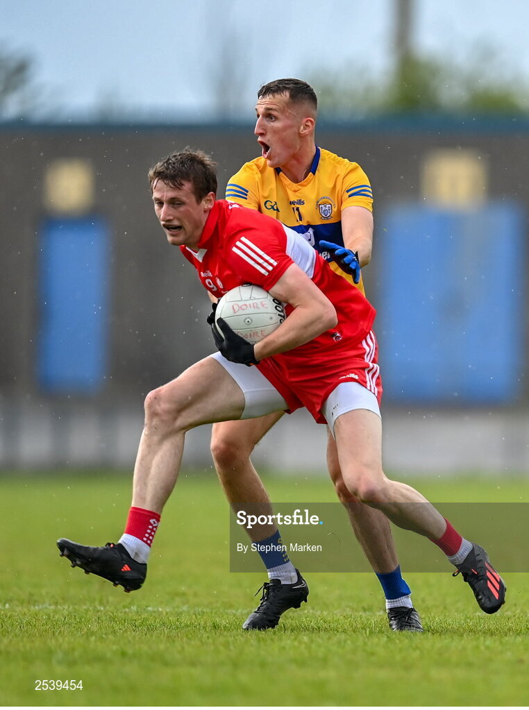 17 June 2023; Brendan Rogers of Derry in action against Emmet McMahon of Clare during the GAA Football All-Ireland Senior Championship Round 3 match between Derry and Clare at Glennon Brothers Pearse Park in Longford. Photo by Stephen Marken/Sportsfile