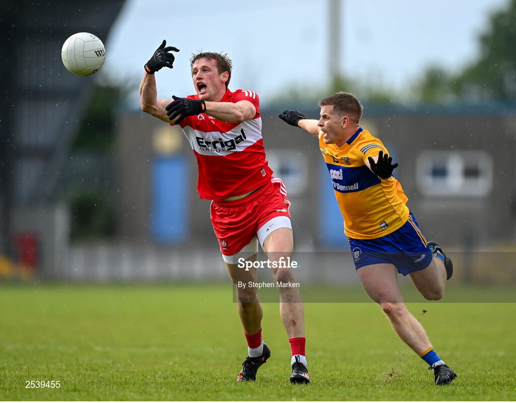 17 June 2023; Brendan Rogers of Derry in action against Pádraic Collins of Clare during the GAA Football All-Ireland Senior Championship Round 3 match between Derry and Clare at Glennon Brothers Pearse Park in Longford. Photo by Stephen Marken/Sportsfile