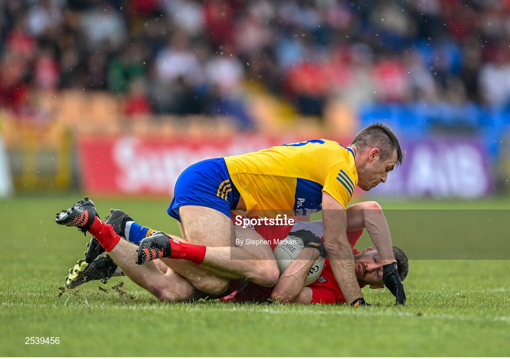 17 June 2023; Niall Loughlin of Derry in action against Ciaran Russell of Clare during the GAA Football All-Ireland Senior Championship Round 3 match between Derry and Clare at Glennon Brothers Pearse Park in Longford. Photo by Stephen Marken/Sportsfile