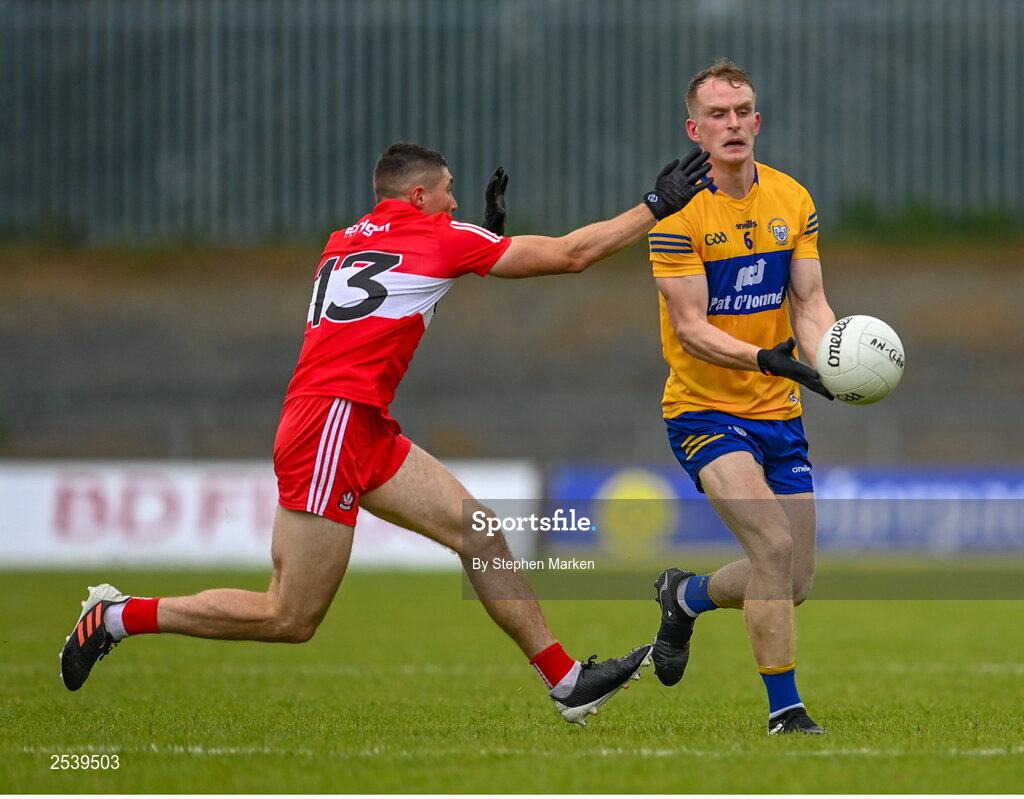 17 June 2023; Pearse Lillis of Clare in action against Ciaran McFaul of Derry during the GAA Football All-Ireland Senior Championship Round 3 match between Derry and Clare at Glennon Brothers Pearse Park in Longford. Photo by Stephen Marken/Sportsfile