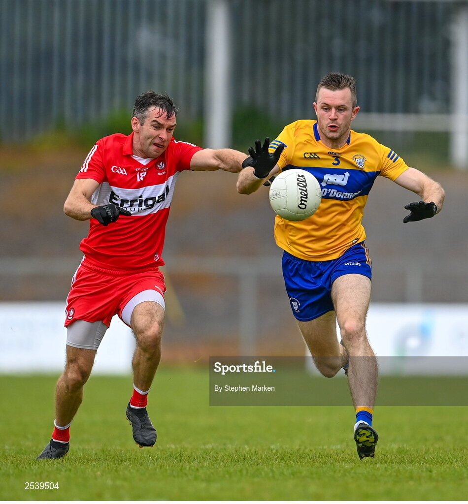 17 June 2023; Benny Heron of Derry in action against Ciaran Russell of Clare during the GAA Football All-Ireland Senior Championship Round 3 match between Derry and Clare at Glennon Brothers Pearse Park in Longford. Photo by Stephen Marken/Sportsfile