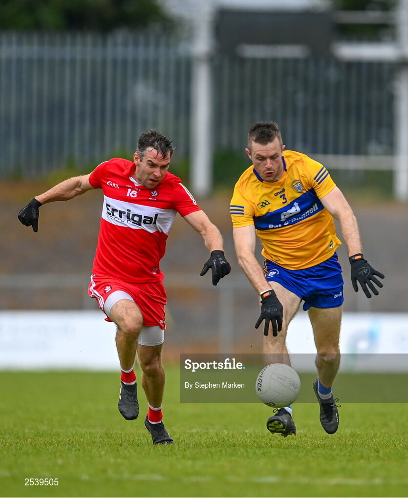 17 June 2023; Benny Heron of Derry in action against Ciaran Russell of Clare during the GAA Football All-Ireland Senior Championship Round 3 match between Derry and Clare at Glennon Brothers Pearse Park in Longford. Photo by Stephen Marken/Sportsfile