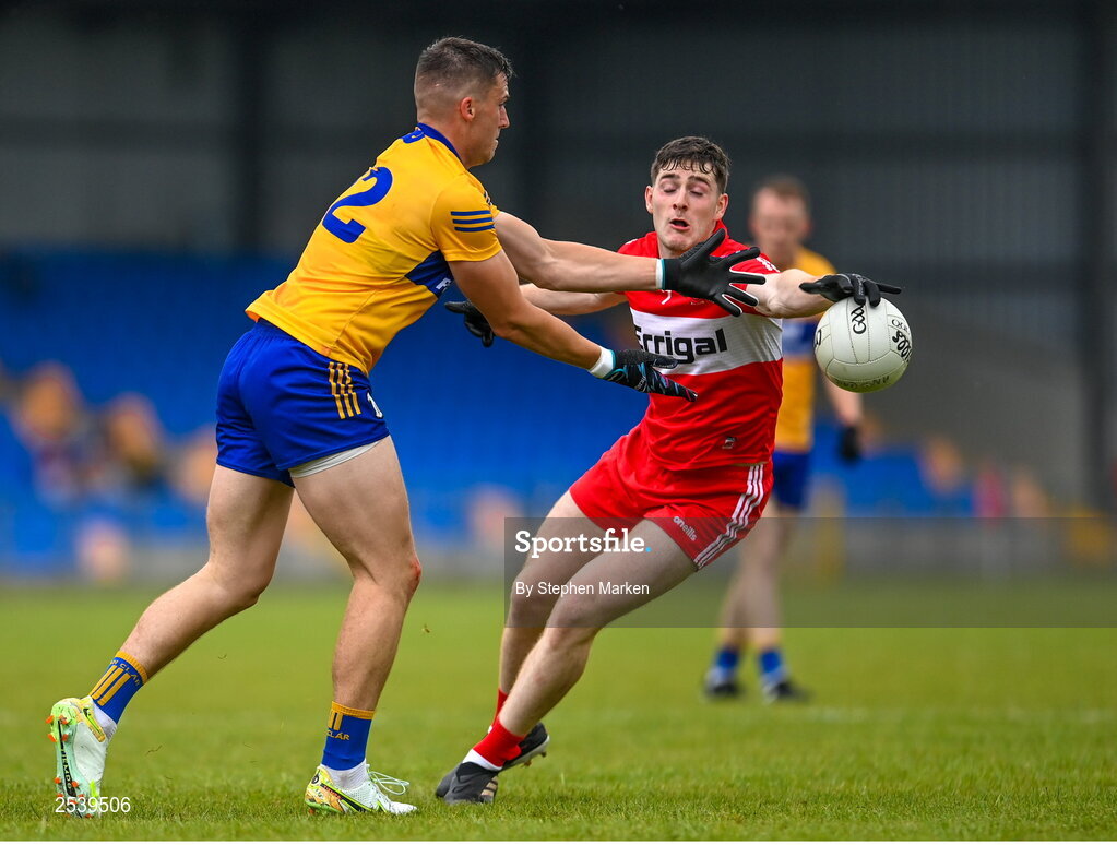 17 June 2023; Jamie Malone of Clare in action against Padraig McGrogan of Derry during the GAA Football All-Ireland Senior Championship Round 3 match between Derry and Clare at Glennon Brothers Pearse Park in Longford. Photo by Stephen Marken/Sportsfile