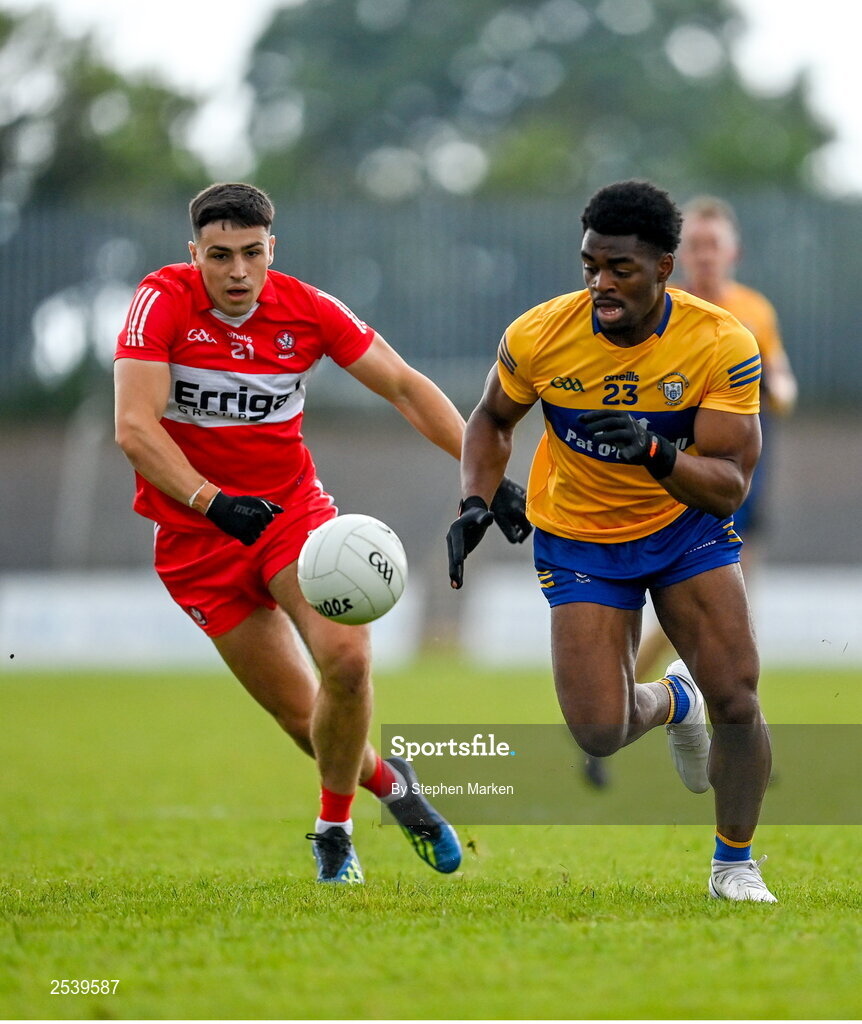 17 June 2023; Ikem Ugweru of Clare in action against Ben McCarron of Derry during the GAA Football All-Ireland Senior Championship Round 3 match between Derry and Clare at Glennon Brothers Pearse Park in Longford. Photo by Stephen Marken/Sportsfile