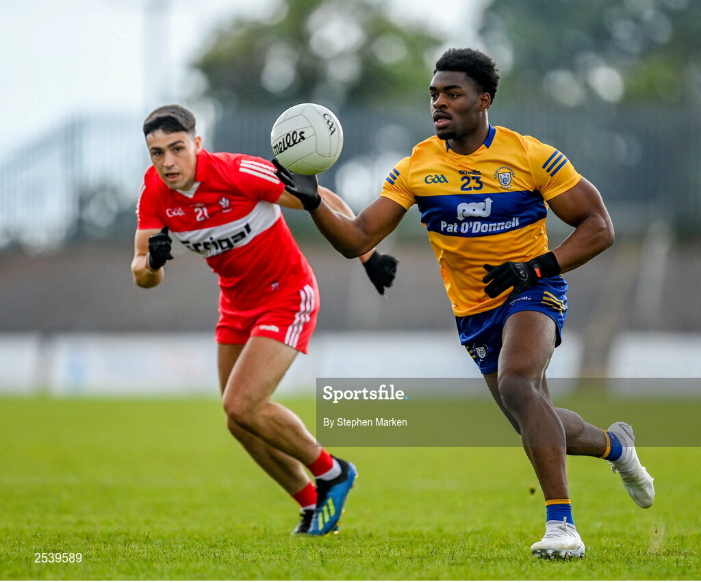 17 June 2023; Ikem Ugweru of Clare in action against Ben McCarron of Derry during the GAA Football All-Ireland Senior Championship Round 3 match between Derry and Clare at Glennon Brothers Pearse Park in Longford. Photo by Stephen Marken/Sportsfile