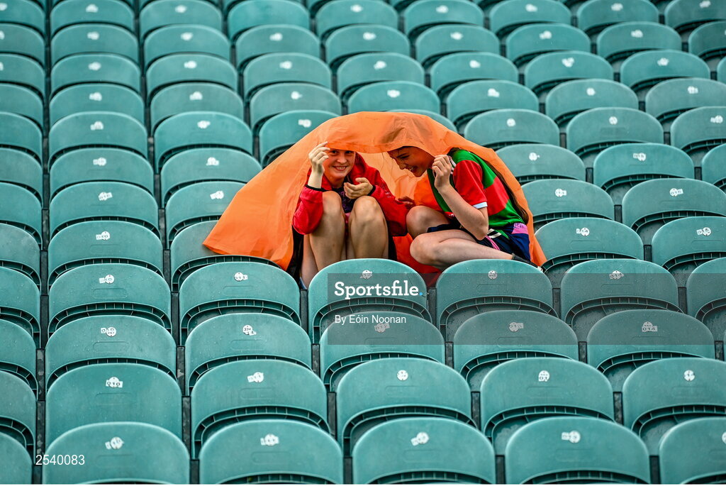 18 June 2023; Supporters take shelter from the rain before the GAA Football All-Ireland Senior Championship Round 3 match between Cork and Mayo at TUS Gaelic Grounds in Limerick. Photo by Eóin Noonan/Sportsfile