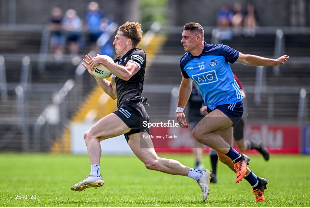 18 June 2023; Pat Spillane of Sligo in action against Brian Howard of Dublin during the GAA Football All-Ireland Senior Championship Round 3 match between Dublin and Sligo at Kingspan Breffni in Cavan. Photo by Ramsey Cardy/Sportsfile