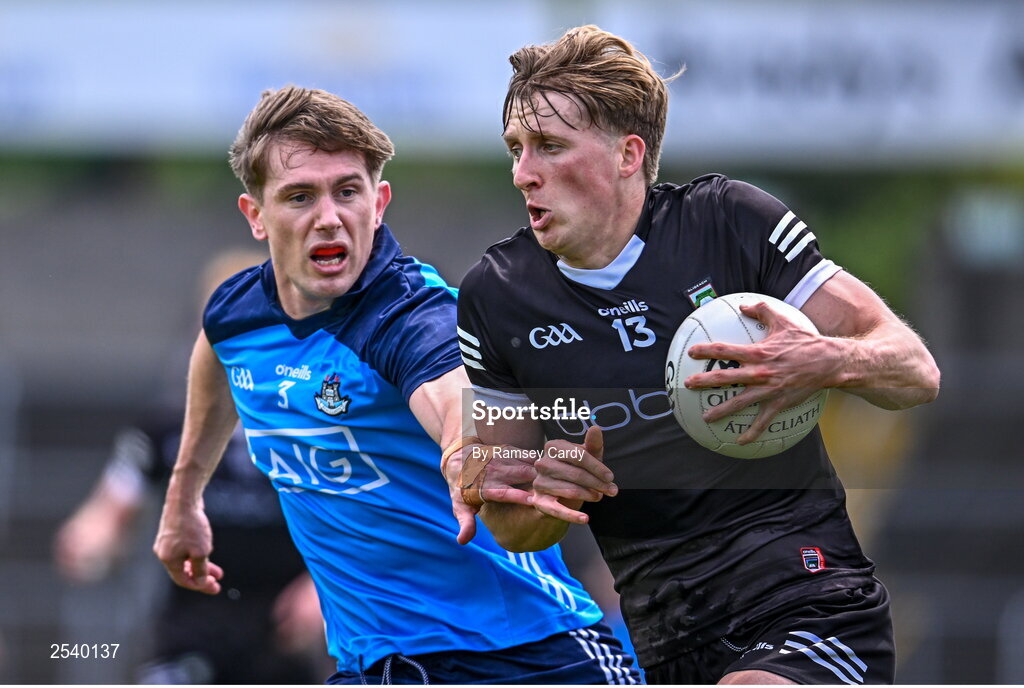 18 June 2023; Pat Spillane of Sligo in action against Michael Fitzsimons of Dublin during the GAA Football All-Ireland Senior Championship Round 3 match between Dublin and Sligo at Kingspan Breffni in Cavan. Photo by Ramsey Cardy/Sportsfile