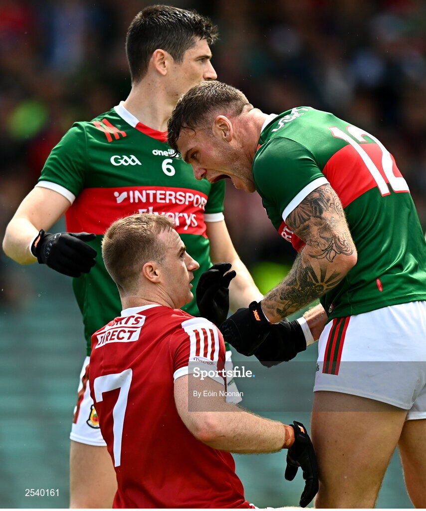 18 June 2023; Jordan Flynn of Mayo celebrates in front of Mattie Taylor of Cork after winning a free during the GAA Football All-Ireland Senior Championship Round 3 match between Cork and Mayo at TUS Gaelic Grounds in Limerick. Photo by Eóin Noonan/Sportsfile