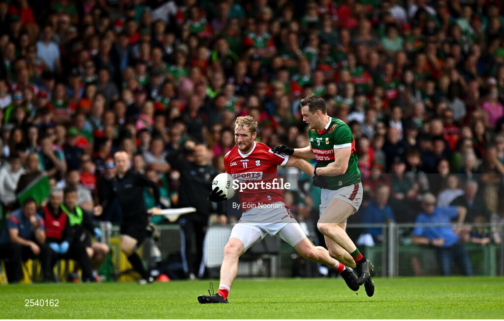 18 June 2023; Ruairi Deane of Cork in action against Matthew Ruane of Mayo during the GAA Football All-Ireland Senior Championship Round 3 match between Cork and Mayo at TUS Gaelic Grounds in Limerick. Photo by Eóin Noonan/Sportsfile