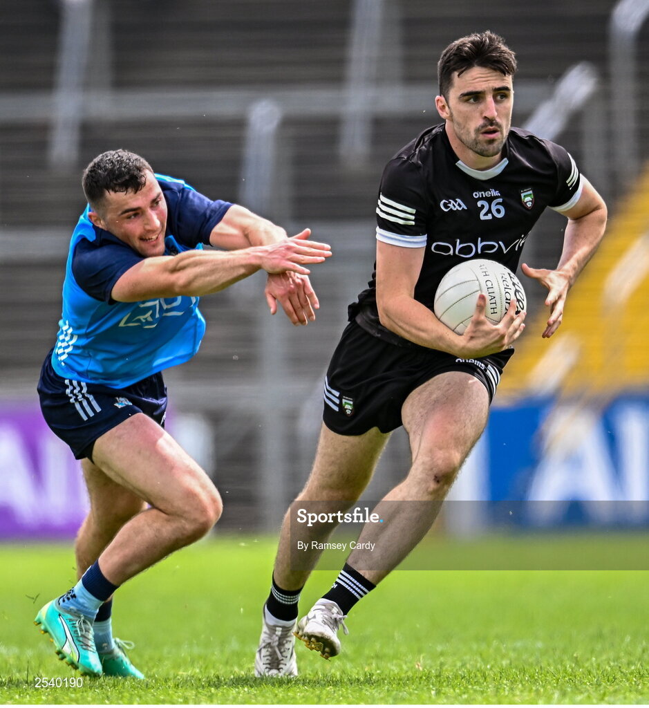 18 June 2023; Mikey Gordon of Sligo evades the tackle of Colm Basquel of Dublin during the GAA Football All-Ireland Senior Championship Round 3 match between Dublin and Sligo at Kingspan Breffni in Cavan. Photo by Ramsey Cardy/Sportsfile