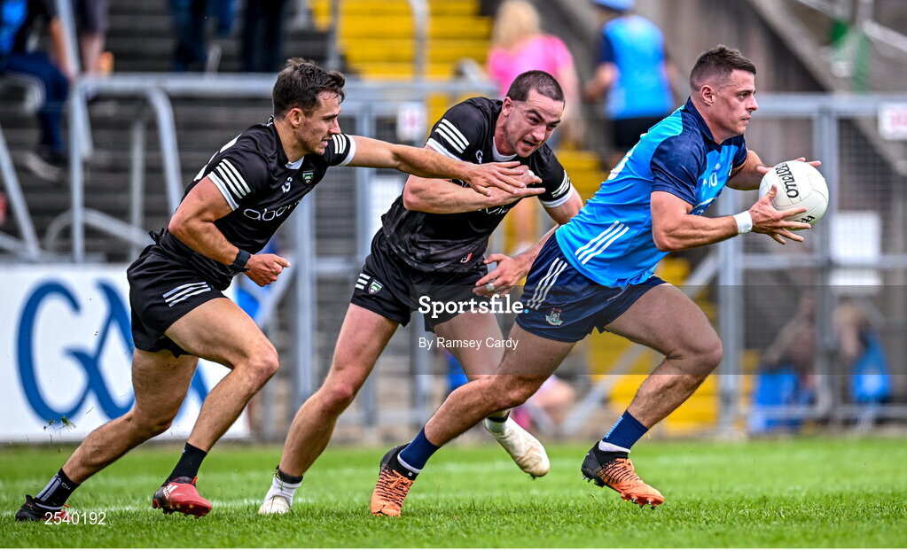 18 June 2023; Brian Howard of Dublin in action against Niall Murphy, left, and Paul Kilcoyne of Sligo during the GAA Football All-Ireland Senior Championship Round 3 match between Dublin and Sligo at Kingspan Breffni in Cavan. Photo by Ramsey Cardy/Sportsfile