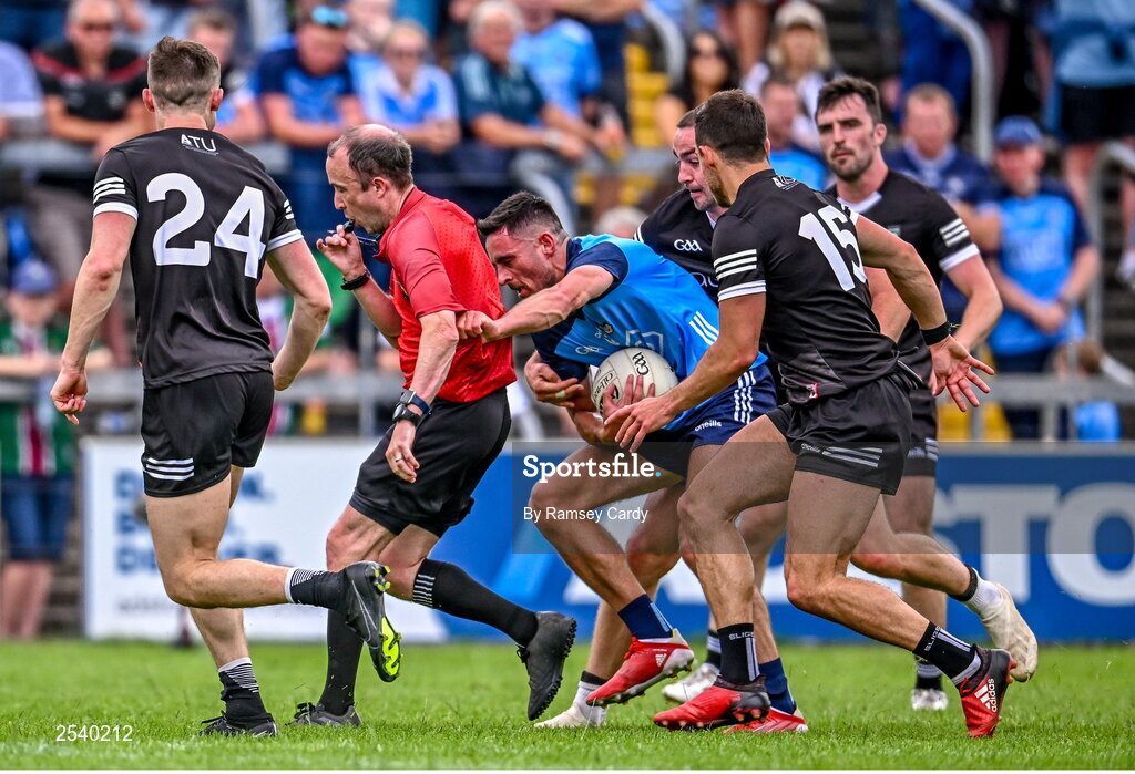 18 June 2023; Niall Scully of Dublin collides with referee Niall Cullen during the GAA Football All-Ireland Senior Championship Round 3 match between Dublin and Sligo at Kingspan Breffni in Cavan. Photo by Ramsey Cardy/Sportsfile