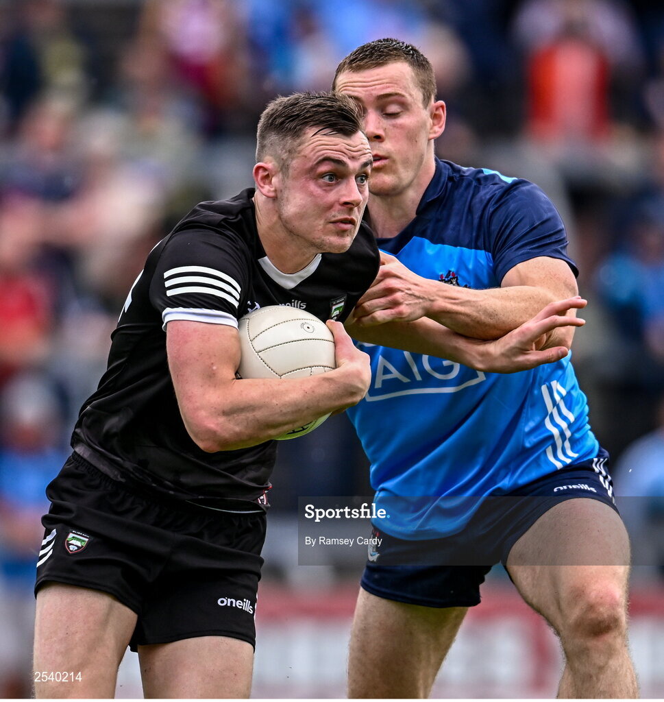 18 June 2023; Luke Nicholson of Sligo in action against Con O'Callaghan of Dublin during the GAA Football All-Ireland Senior Championship Round 3 match between Dublin and Sligo at Kingspan Breffni in Cavan. Photo by Ramsey Cardy/Sportsfile
