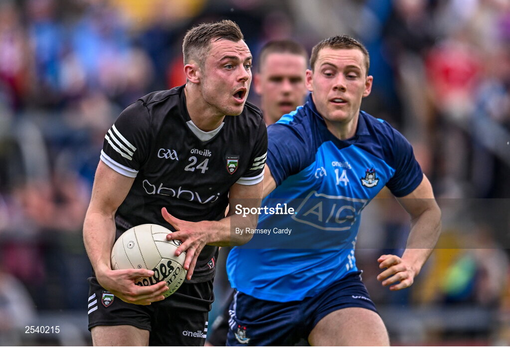 18 June 2023; Luke Nicholson of Sligo in action against Con O'Callaghan of Dublin during the GAA Football All-Ireland Senior Championship Round 3 match between Dublin and Sligo at Kingspan Breffni in Cavan. Photo by Ramsey Cardy/Sportsfile