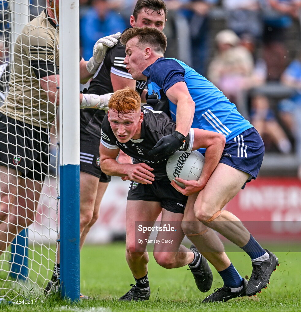 18 June 2023; Evan Lyons of Sligo is tackled by Daire Newcombe of Dublin during the GAA Football All-Ireland Senior Championship Round 3 match between Dublin and Sligo at Kingspan Breffni in Cavan. Photo by Ramsey Cardy/Sportsfile