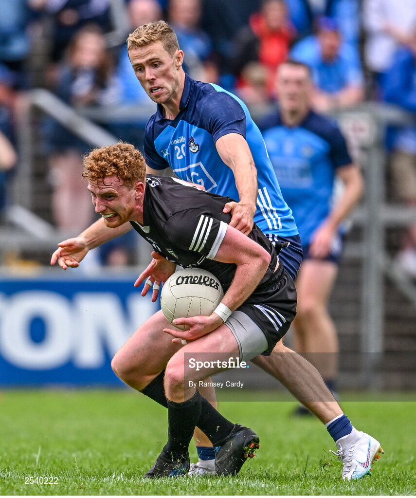 18 June 2023; Sean Carrabine of Sligo in action against Paul Mannion of Dublin during the GAA Football All-Ireland Senior Championship Round 3 match between Dublin and Sligo at Kingspan Breffni in Cavan. Photo by Ramsey Cardy/Sportsfile