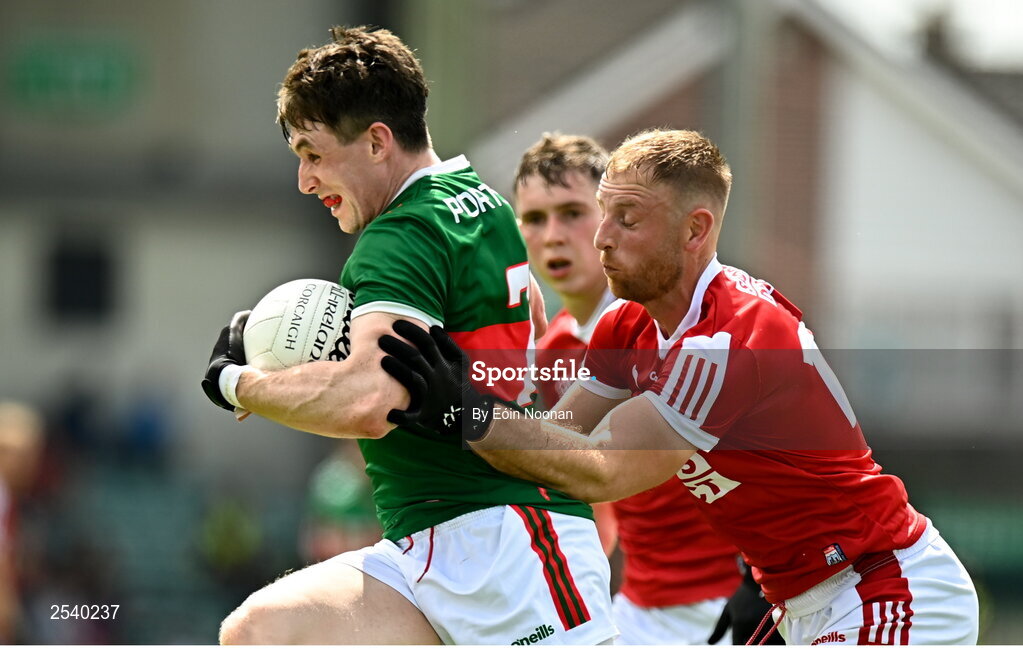 18 June 2023; Paddy Durcan of Mayo is tackled by Killian O'Hanlon of Cork during the GAA Football All-Ireland Senior Championship Round 3 match between Cork and Mayo at TUS Gaelic Grounds in Limerick. Photo by Eóin Noonan/Sportsfile