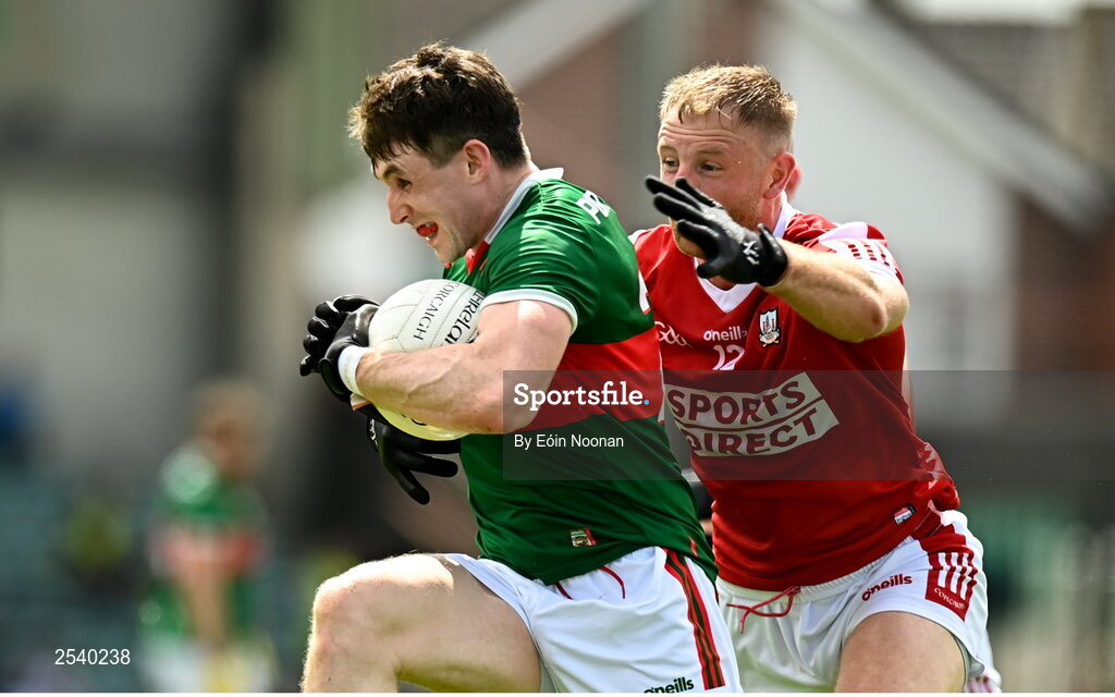 18 June 2023; Paddy Durcan of Mayo is tackled by Killian O'Hanlon of Cork during the GAA Football All-Ireland Senior Championship Round 3 match between Cork and Mayo at TUS Gaelic Grounds in Limerick. Photo by Eóin Noonan/Sportsfile