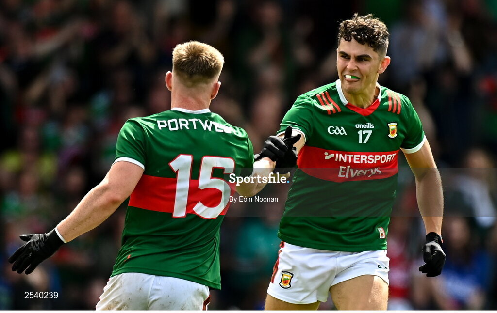 18 June 2023; Tommy Conroy of Mayo celebrates with teammate Ryan O'Donoghue after scoring his side's first goal during the GAA Football All-Ireland Senior Championship Round 3 match between Cork and Mayo at TUS Gaelic Grounds in Limerick. Photo by Eóin Noonan/Sportsfile