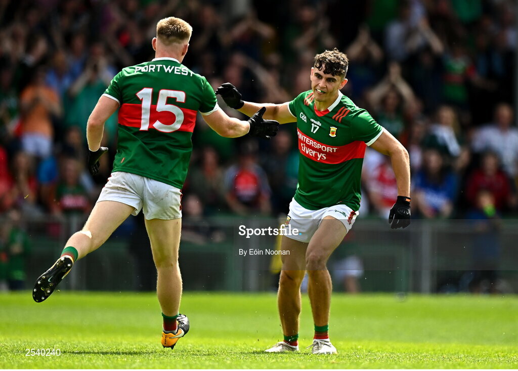 18 June 2023; Tommy Conroy of Mayo celebrates with teammate Ryan O'Donoghue after scoring his side's first goal during the GAA Football All-Ireland Senior Championship Round 3 match between Cork and Mayo at TUS Gaelic Grounds in Limerick. Photo by Eóin Noonan/Sportsfile
