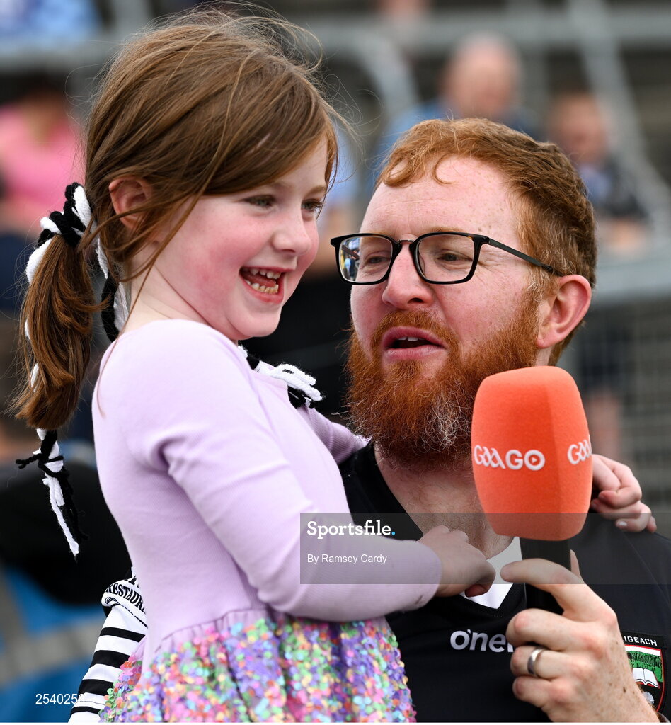 18 June 2023; 5 year old Meabh Devaney, niece of Sligo goalkeeper Aidan Devaney, is interviewed by her dad Stephen, from Calry, Sligo, during the GAA Football All-Ireland Senior Championship Round 3 match between Dublin and Sligo at Kingspan Breffni in Cavan. Photo by Ramsey Cardy/Sportsfile