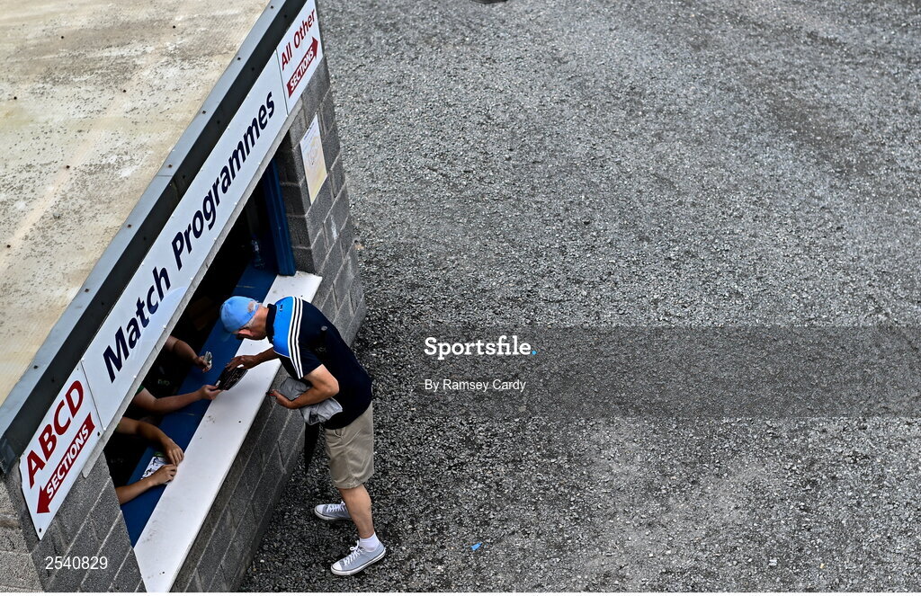 18 June 2023; A Dublin supporter purchases a match programme before the GAA Football All-Ireland Senior Championship Round 3 match between Dublin and Sligo at Kingspan Breffni in Cavan. Photo by Ramsey Cardy/Sportsfile