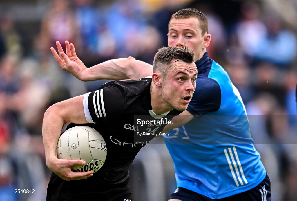 18 June 2023; Luke Nicholson of Sligo in action against Con O'Callaghan of Dublin during the GAA Football All-Ireland Senior Championship Round 3 match between Dublin and Sligo at Kingspan Breffni in Cavan. Photo by Ramsey Cardy/Sportsfile