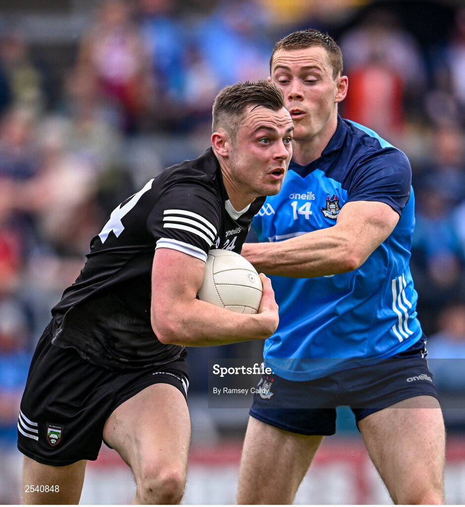 18 June 2023; Luke Nicholson of Sligo in action against Con O'Callaghan of Dublin during the GAA Football All-Ireland Senior Championship Round 3 match between Dublin and Sligo at Kingspan Breffni in Cavan. Photo by Ramsey Cardy/Sportsfile