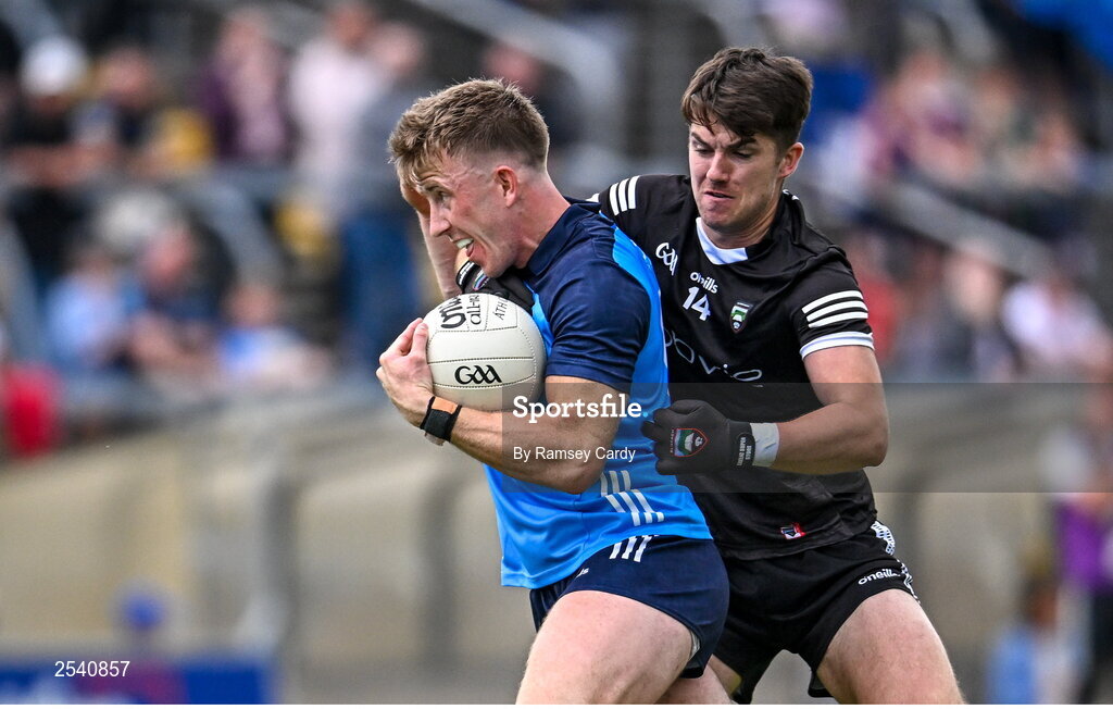 18 June 2023; Seán Bugler of Dublin in action against Patrick O'Connor of Sligo during the GAA Football All-Ireland Senior Championship Round 3 match between Dublin and Sligo at Kingspan Breffni in Cavan. Photo by Ramsey Cardy/Sportsfile