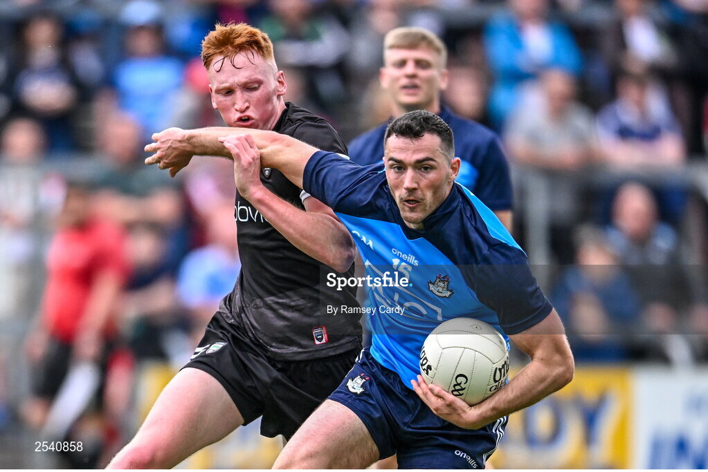 18 June 2023; Colm Basquel of Dublin in action against Evan Lyons of Sligo during the GAA Football All-Ireland Senior Championship Round 3 match between Dublin and Sligo at Kingspan Breffni in Cavan. Photo by Ramsey Cardy/Sportsfile