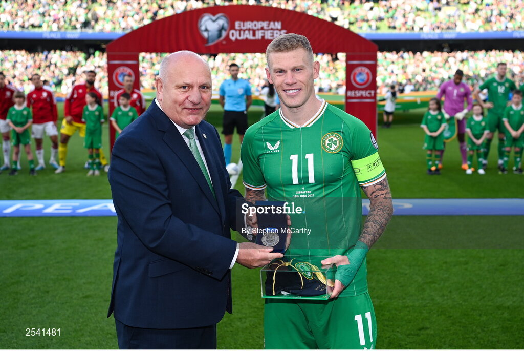 19 June 2023; Republic of Ireland captain James McClean is presented with his medal and 100th cap from FAI President Gerry McAnaney before the UEFA EURO 2024 Championship qualifying group B match between Republic of Ireland and Gibraltar at the Aviva Stadium in Dublin. Photo by Stephen McCarthy/Sportsfile