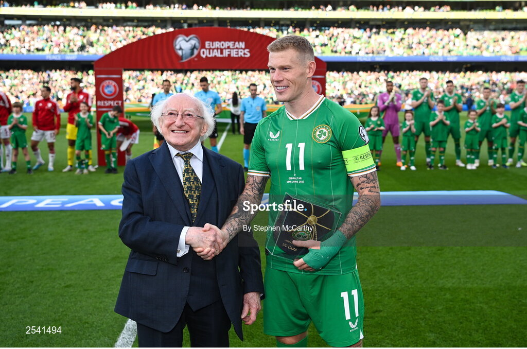 19 June 2023; Republic of Ireland captain James McClean, on the occassion of his 100th international cap, with the President of Ireland Michael D Higgins, before the UEFA EURO 2024 Championship qualifying group B match between Republic of Ireland and Gibraltar at the Aviva Stadium in Dublin. Photo by Stephen McCarthy/Sportsfile