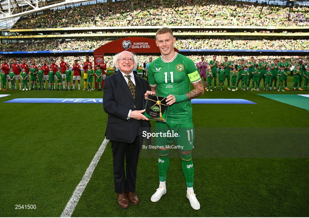 19 June 2023; Republic of Ireland captain James McClean, on the occassion of his 100th international cap, with the President of Ireland Michael D Higgins, before the UEFA EURO 2024 Championship qualifying group B match between Republic of Ireland and Gibraltar at the Aviva Stadium in Dublin. Photo by Stephen McCarthy/Sportsfile