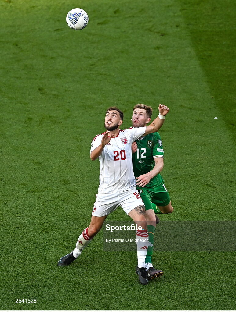 19 June 2023; Ethan Britto of Gibraltar in action against Nathan Collins of Republic of Ireland during the UEFA EURO 2024 Championship qualifying group B match between Republic of Ireland and Gibraltar at the Aviva Stadium in Dublin. Photo by Piaras Ó Mídheach/Sportsfile