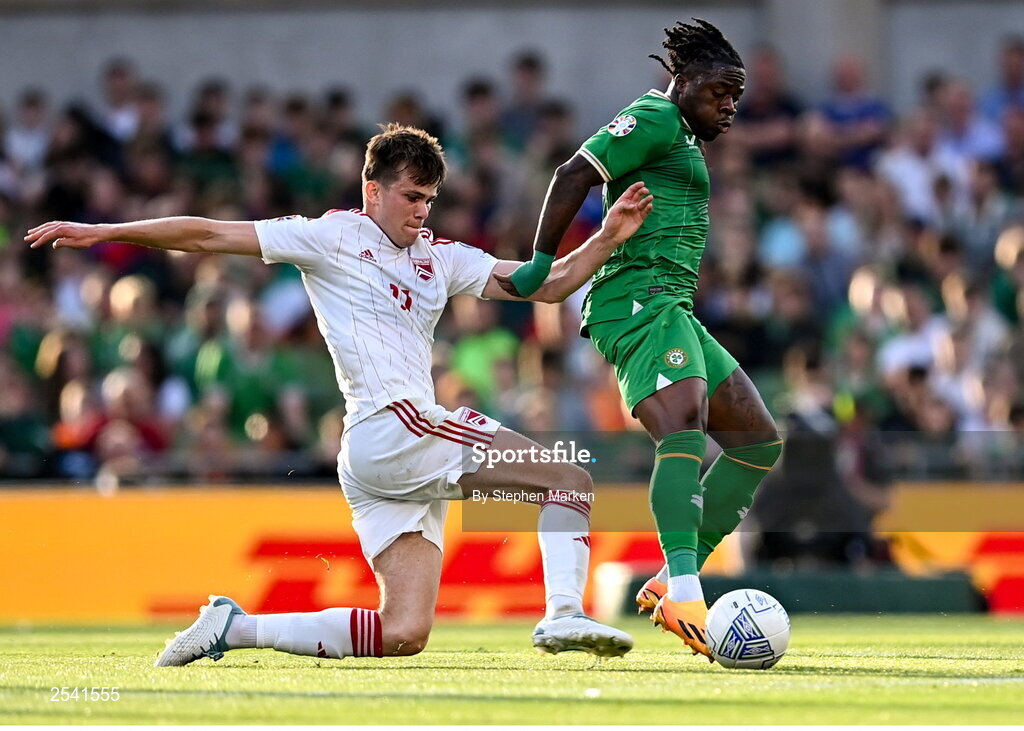 19 June 2023; Michael Obafemi of Republic of Ireland in action against Niels Hartman of Gibraltar during the UEFA EURO 2024 Championship qualifying group B match between Republic of Ireland and Gibraltar at the Aviva Stadium in Dublin. Photo by Stephen Marken/Sportsfile