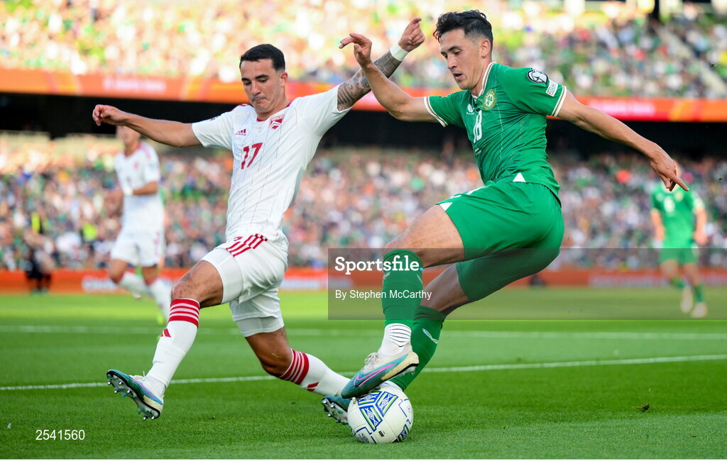 19 June 2023; Jamie McGrath of Republic of Ireland in action against Kian Ronan of Gibraltar during the UEFA EURO 2024 Championship qualifying group B match between Republic of Ireland and Gibraltar at the Aviva Stadium in Dublin. Photo by Stephen McCarthy/Sportsfile
