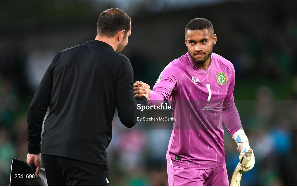 19 June 2023; Republic of Ireland goalkeeper Gavin Bazunu with Republic of Ireland coach John O'Shea after the UEFA EURO 2024 Championship qualifying group B match between Republic of Ireland and Gibraltar at the Aviva Stadium in Dublin. Photo by Stephen McCarthy/Sportsfile