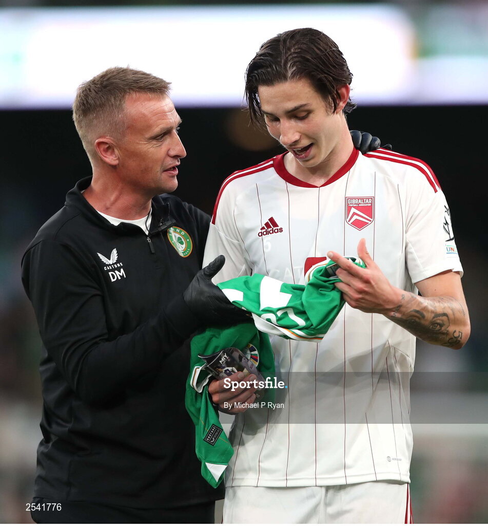 19 June 2023; Republic of Ireland chartered physiotherapist Danny Miller presents Louie Annesley of Gibraltar with a Republic of Ireland jersey after the UEFA EURO 2024 Championship qualifying group B match between Republic of Ireland and Gibraltar at the Aviva Stadium in Dublin. Photo by Michael P Ryan/Sportsfile