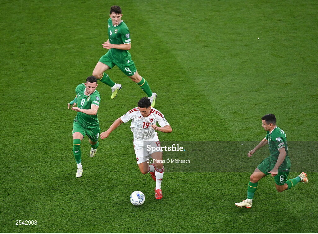 19 June 2023; Tjay De Barr of Gibraltar tries to get away from Republic of Ireland players, Josh Cullen, right, Alan Browne and Dara O'Shea, behind during the UEFA EURO 2024 Championship qualifying group B match between Republic of Ireland and Gibraltar at the Aviva Stadium in Dublin. Photo by Piaras Ó Mídheach/Sportsfile