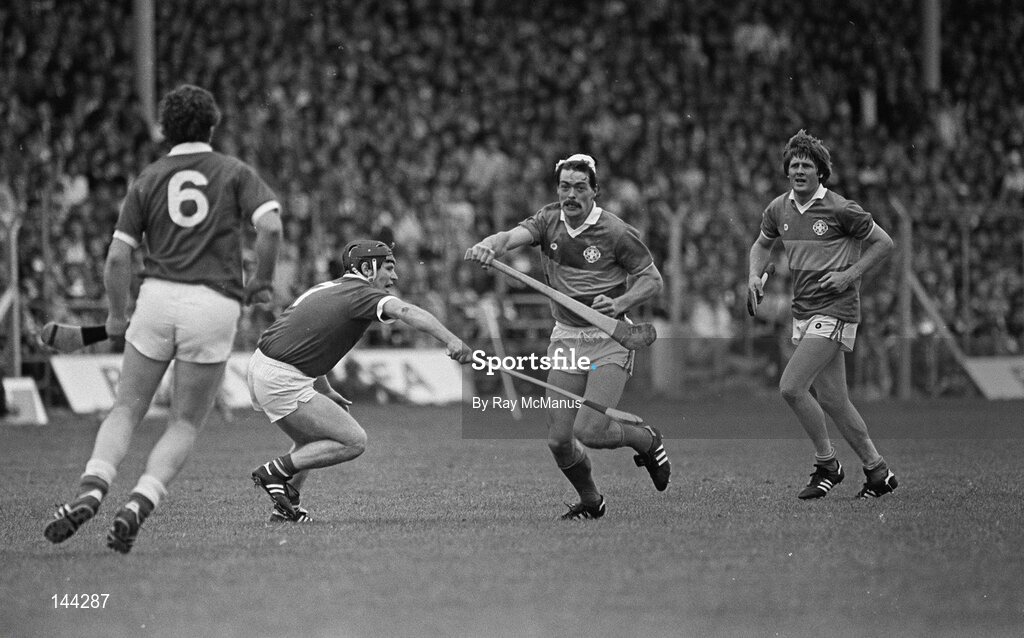 15 July 1984; Donie O'Connell, Tipperary, is tackled by Dermot McCurtain, 7, Cork . Munster Hurling Final, Tipperary v Cork, Semple Stadium, Thurles, Co. Tipperary. Picture credit; Ray McManus / SPORTSFILE