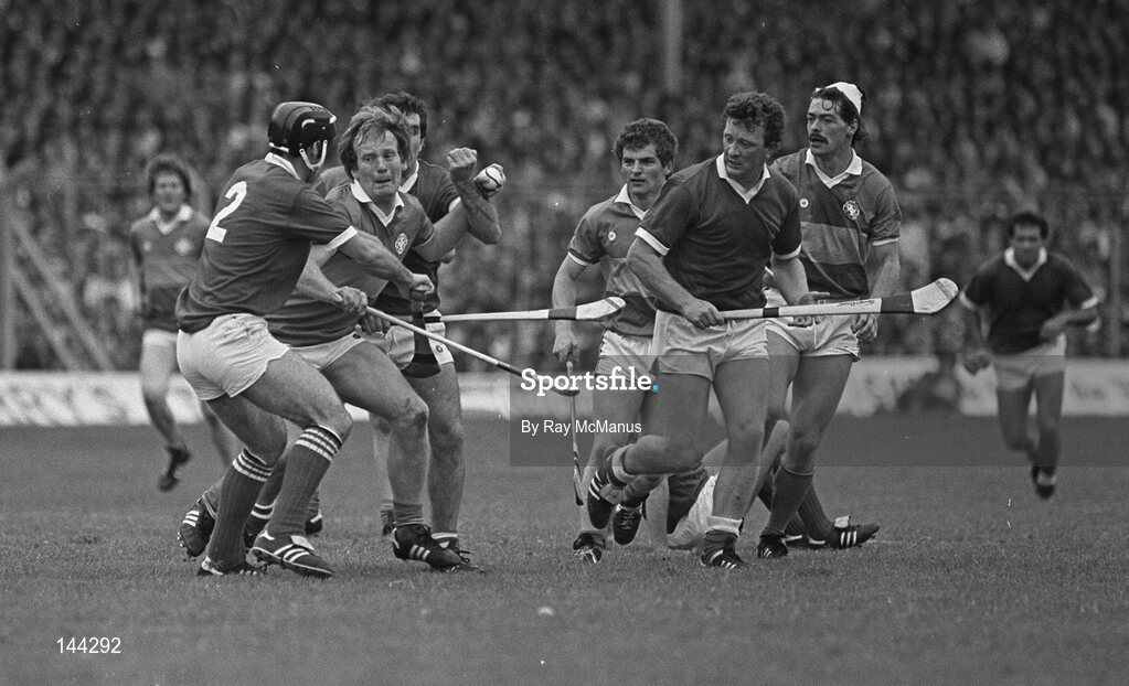 15 July 1984; Noel O'Dwyer, Tipperary, is tackled by Denis Mulcahy, 2, Cork under the watchful eye of John Crowley, 2nd from right, Cork, and Donie O'Connell, far right, Tipperary. Munster Hurling Final, Tipperary v Cork, Semple Stadium, Thurles, Co. Tipperary. Picture credit; Ray McManus / SPORTSFILE