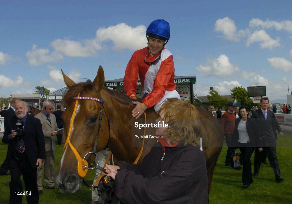 26 June 2004; Chorist, with Darryl Holland up, is led in by stable girl Hanna Thompson after winning the Audi Pretty Polly Stakes. Curragh Racecourse, Co. Kildare. Picture credit; Matt Browne / SPORTSFILE