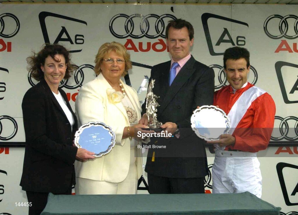 26 June 2004; Winning connections, from left, Maurine Haggas wife of trainer William Haggas, Marie O'Callaghan from Audi, Julian Dollar and jockie Darryl Holland pictured after winning the Audi Pretty Polly Stakes. Curragh Racecourse, Co. Kildare. Picture credit; Matt Browne / SPORTSFILE