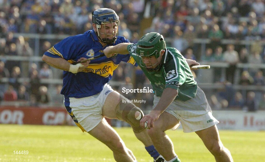 26 June 2004; Andrew O'Shaughnessy, Limerick, is tackled by Martin Maher, Tipperary. Guinness Senior Hurling Championship Qualifier, Round 1, Limerick v Tipperary, Gaelic Grounds, Limerick. Picture credit; Pat Murphy / SPORTSFILE