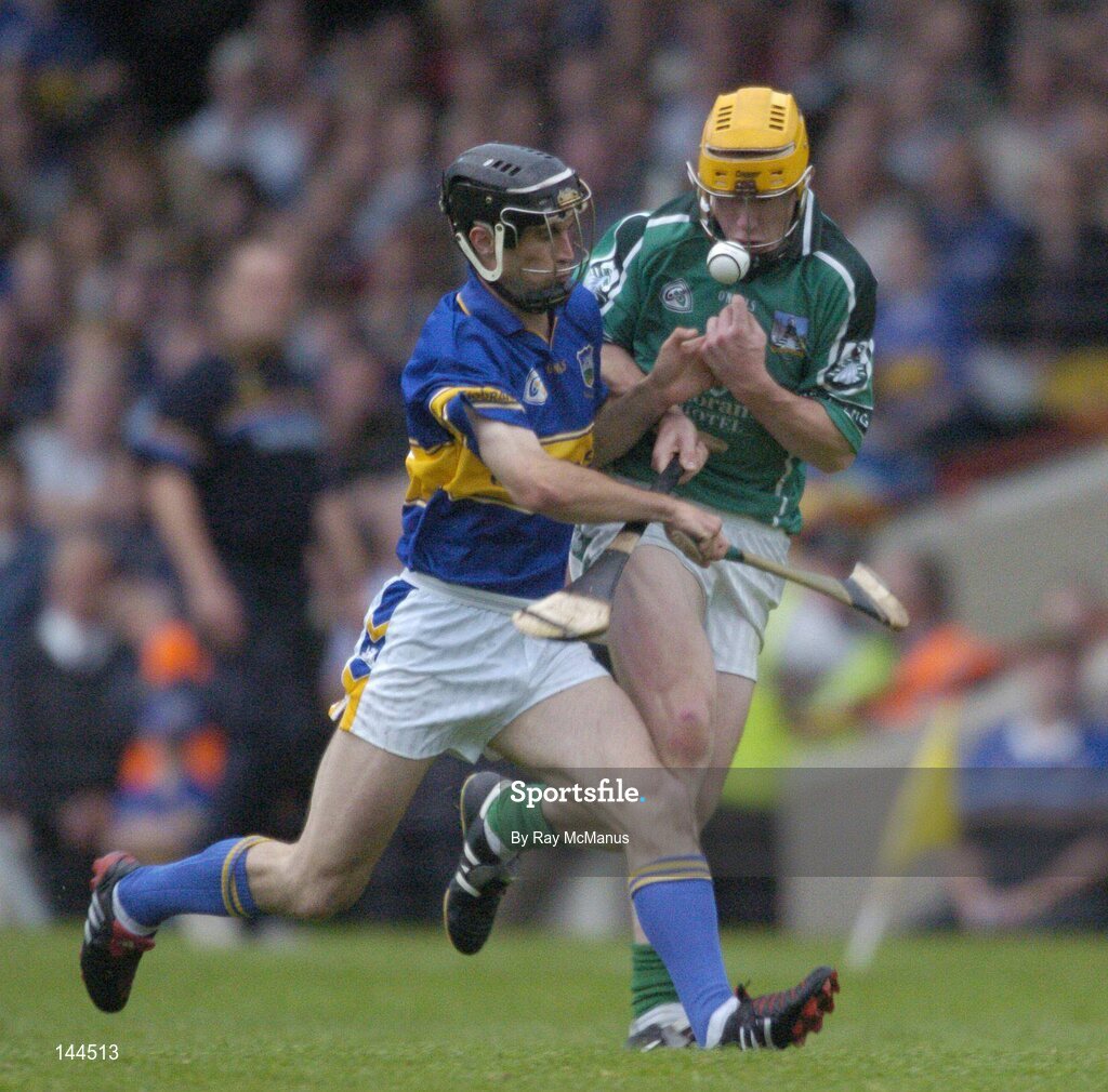 26 June 2004; Niall Moran, Limerick, is tackled by Thomas Dunne, Tipperary. Guinness Senior Hurling Championship Qualifier, Round 1, Limerick v Tipperary, Gaelic Grounds, Limerick. Picture credit; Ray McManus / SPORTSFILE